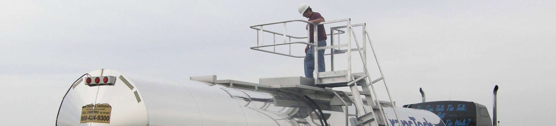 A man standing on top of a metal platform.