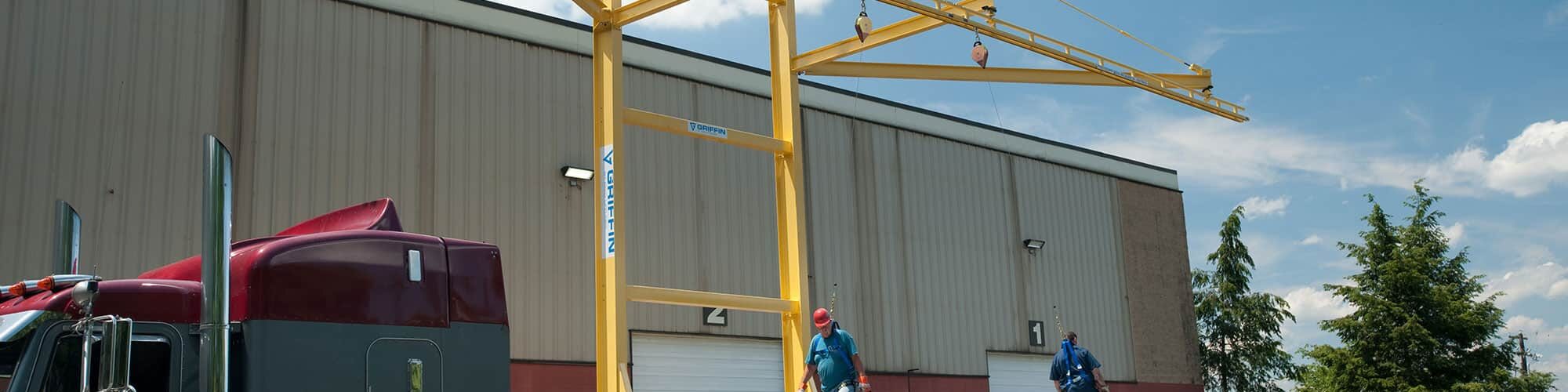 A man standing on top of a yellow structure.