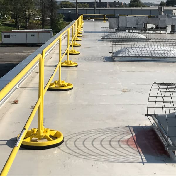 100% Made in USA, OSHA Compliant & Non-Penetrating Freestanding Roof Safety Rail is Permanent and Non-Penetrating